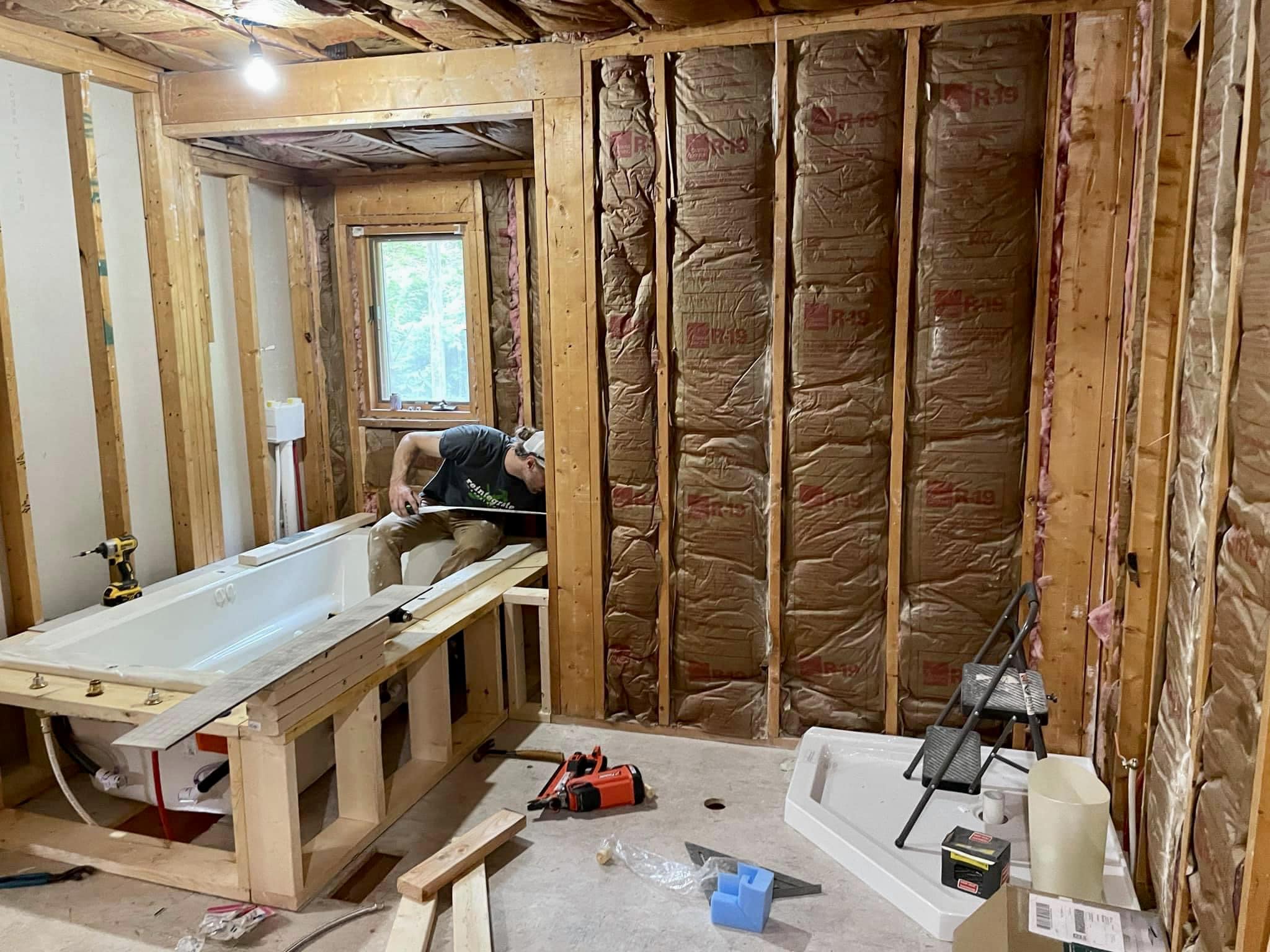 A member of the Reintegrate Appalachia crew working on a bathroom remodel.